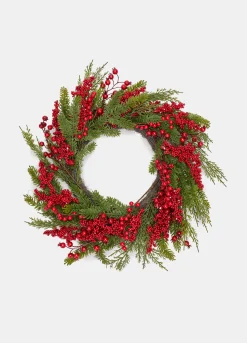 Ghirlanda con rami verdi e bacche