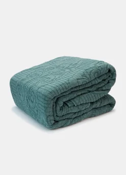 Trapunta a due piazze con motivo tono su tono